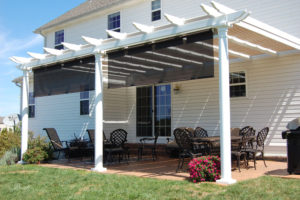 newly installed pergola shade structure with paver patio and outdoor furniture