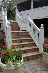 decorative steps leading up to a covered patio