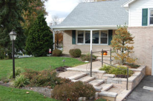 newly installed stone walk, walls, and steps in front of a home
