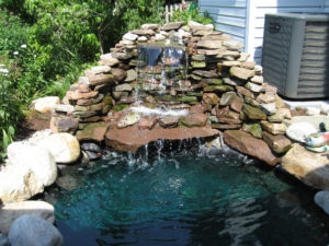 a stone waterfall into a pond